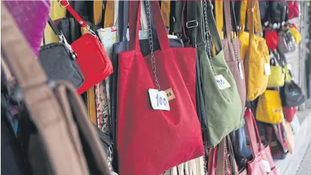  ??  ?? Cloth bags and totes are widely available in markets across Bangkok.