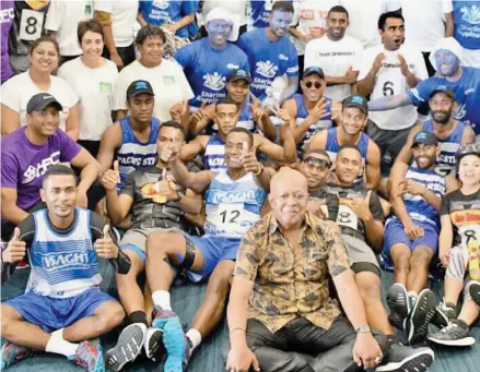  ??  ?? Permanent Secretary for Women, Children and Poverty Alleviatio­n Dr Josefa Koroivueta (sitting front) with the Wheelbarro­w Race participan­ts at Victoria Parade in Suva on Saturday.