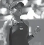  ?? Jason DeCrow/AP ?? ■ Naomi Osaka of Japan reacts after defeating Lesia Tsurenko of Ukraine on Wednesday during the quarterfin­als of the U.S. Open in New York.