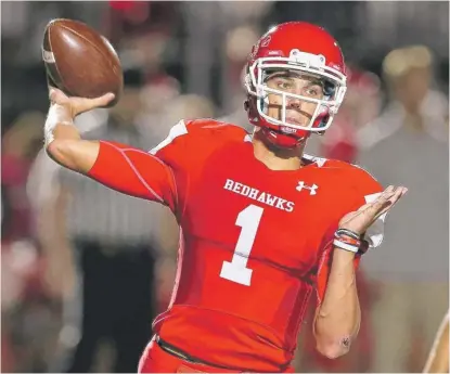  ?? ALLEN CUNNINGHAM/FOR THE SUN TIMES ?? Naperville Central quarterbac­k Payton Thorne threw four touchdown passes and ran for another.