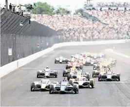  ?? JUSTIN CASTERLINE Getty Images/TNS ?? The first lap or two of the Indy 500, when all of the cars are packed, is unlike any sensation in sports.