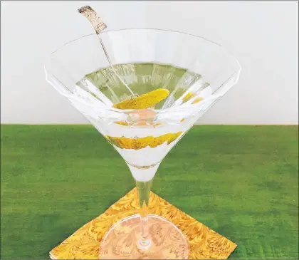  ?? ELIZABETH KARMEL VIA AP ?? A “Smoked Martini” from a recipe by Elizabeth Karmel, in Amagansett, N.Y. A whiff of scotch whisky lends a smokey note to an ice-cold vodka martini.