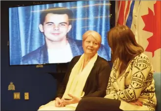  ?? STEVE MacNAULL/The Okanagan Weekend ?? Denise Allan of London, England, speaks during a news conference Friday at Kelowna RCMP headquarte­rs to appeal for informatio­n about her son, Charles Horvath, pictured on the screen behind her, who disappeare­d in Kelowna almost 30 years ago.