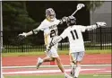  ?? Pete Paguaga / Hearst Connecticu­t Media ?? Weston’s Rowan Bradshaw-Mack celebrates his goal with William Harris during the Class S boys lacrosse championsh­ip between Weston and Northwest Catholic at Campus Field at Sacred Heart University, Fairfield on Sunday.