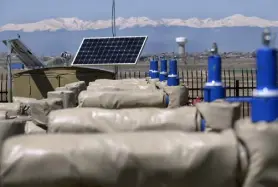  ?? Kathryn Scott, Special to The Denver Post, file ?? With a solar panel generating power, the bright blue lubricator­s pop out from the top of the well heads at a Crestone Peak Resources oil and gas drilling site in Firestone.