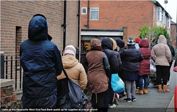  ?? ?? Users of the Newcastle West End Food Bank queue up for supplies at a local church