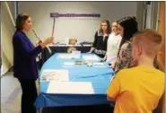  ?? TAWANA ROBERTS — THE NEWS-HERALD ?? Crossroads Community-Based Supervisor Jennifer Mongenel teaches students how to create therapeuti­c art projects on Nov. 2.