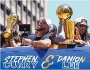  ?? ERIC RISBERG/ASSOCIATED PRESS ?? Stephen Curry and Damion Lee, right, ride in the Golden State Warriors’ NBA championsh­ip parade on June 20 in San Francisco. Curry will host this year’s ESPYs.