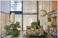  ??  ?? A view of the living room with draperies drawn to reduce light exposure, 2016. Photo by Leslie Schwartz, © Eames Office.