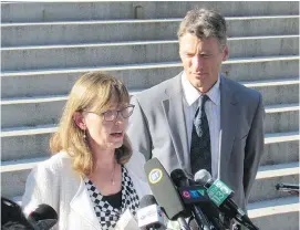  ?? ERIC MACKENZIE/POSTMEDIA NEWS FILES ?? Mayor Gregor Robertson listens as Kathleen Llewellyn-Thomas, the city’s general manager of community services, talks about an empty-home tax on Sept. 14.