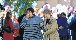  ?? Picture: Simphiwe Nkwali ?? Grieving mourners leave the funeral of Sharnelle Hough and Marna Engelbrech­t on Friday.