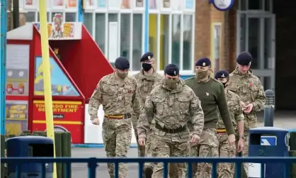  ?? Photograph: Christophe­r Furlong/Getty Images ?? Soldiers arrive at Pontins by Ainsdale beach, Southport, Merseyside on Thursday to set up a mass Covid-19 testing facility.