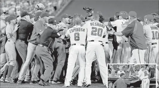  ?? | ALEX BRANDON~AP ?? ABOVE: Umpires attempt to restore order after the benches and bullpens emptied. RIGHT: Nationals third-base coach Bo Porter has words with Cubs bench coach Jamie Quirk (left).