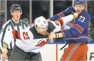  ?? GETTY ?? Kurtis MacDermid and Rangers’ Matt Rempe square off, along with everyone else, Wednesday at MSG.