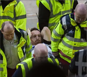  ?? Photo: Matt Browne/Sportsfile ?? Dundalk captain Stephen O’Donnell leaves the field on a stretcher just before half-time in last week’s Premier Division match in Waterford.