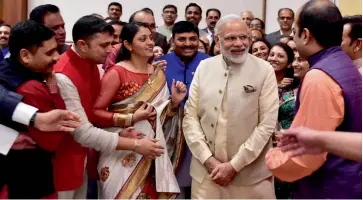  ?? — PTI ?? Prime Minister Narendra Modi interacts with members of the Indian community in Doha, Qatar, on Sunday.