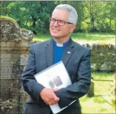  ??  ?? Reverend Scott Burton outside Clachan Church after his induction.