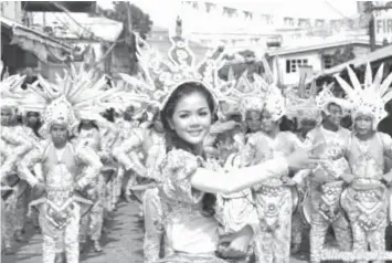  ?? PHOTO COURTESY OF BILIRANISL­AND.COM ?? Bagasumbol Festival dancers entertain the crowd during last year’s fiesta in Naval, Biliran.