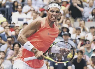  ??  ?? 0 Rafael Nadal celebrates his match point against Nikoloz Basilashvi­li at Flushing Meadows.