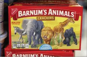  ?? CHARLIE NEIBERGALL — THE ASSOCIATED PRESS ?? A box of Nabisco Barnum’s Animals crackers is displayed on the shelf of a local grocery store in Des Moines, Iowa. Mondelez Internatio­nal says it has redesigned the packaging of its Barnum’s Animals crackers after relenting to pressure from People for the Ethical Treatment of Animals.