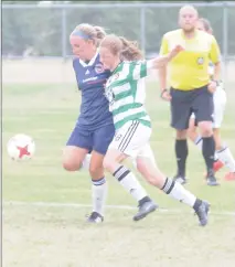  ?? Herald photo by Dale Woodard ?? Aislinn Williston of the Lethbridge Football Club battles for the ball with Lethbridge product Maddie Lee of Calgary Foothills WFC during Alberta Major Soccer League action Saturday afternoon at the Servus Sports Centre.