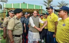 ?? — PTI ?? Union home minister Rajnath Singh greets the team members of second BSF Mount Everest expedition in New Delhi on Tuesday.