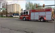  ?? EVAN BRANDT — MEDIANEWS GROUP ?? A truck from the West End Fire Company in Stowe heads for the emergency room entrance to Pottstown Hospital as part of Monday’s salute to medical workers there.