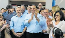  ??  ?? Juntos. Frigerio y Valdés, sellaron la paz entre macristas y radicales.