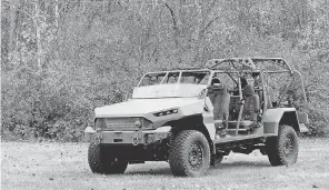  ?? ERIC SEALS/ USA TODAY NETWORK ?? General Motors Defense shows off it new Infantry Squad Vehicle ( ISV) on Tuesday at a news conference at the GM Milford Proving Grounds in Milford, Mich. The vehicle can carry up to nine soldiers and was developed with the input of military personal.