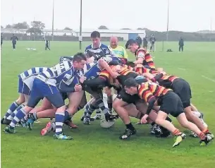  ??  ?? Action from Heaton Moor Junior Colts’ game against Millom