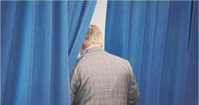  ?? CHRIS YOUNG/THE CANADIAN PRESS ?? Ontario PC Leader Doug Ford has given news conference­s from behind a rope partition, often departing through a side curtain.