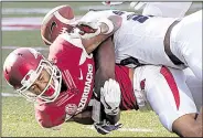  ?? Arkansas Democrat-Gazette/MITCHELL PE MASILUN ?? Kick returner Deon Stewart was separated from the football by a hard hit late in the fourth quarter, a play that highlighte­d the Razorbacks’ special-teams struggles Saturday against TCU.