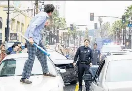  ?? Eric McCandless ABC ?? NATHAN FILLION plays a small-town cop who joins the LAPD in “The Rookie.”