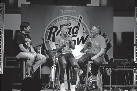  ?? [CHRIS FORBES PHOTOS/BAPTIST MESSENGER] ?? Falls Creek Program Director Todd Sanders interviews Caleb and Jeremy Freeman during the “Falls Creek Road Show” at First Baptist Church of Woodward.