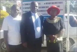  ?? ?? ZLHR lawyer Phillip Shumba (in the middle) posing for a picture with some of the affected villgers