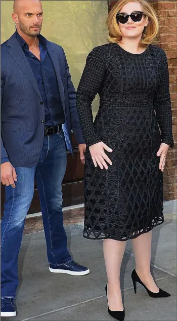  ??  ?? Stealing the limelight? Guard Peter Van der Veen with Adele in New York last month