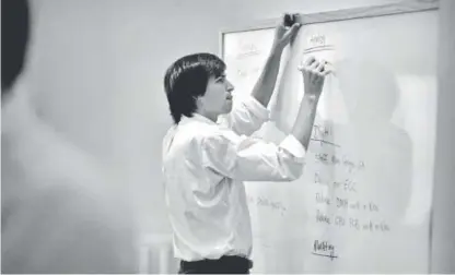  ?? Image provided by Patina Gallery ?? “Steve Jobs Outlining the Digital Revolution, Sonoma, California, 1986,” by photograph­er Doug Menuez. Archival pigment print, 17 inches by 22 inches. Copyright Doug Menuez.