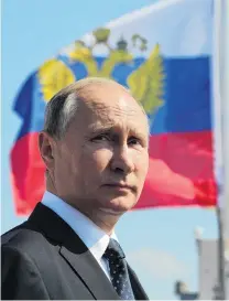  ?? PHOTO: REUTERS ?? Russia’s President Vladimir Putin inspects warships on the Neva river during the Navy Day parade in St Petersburg last month.