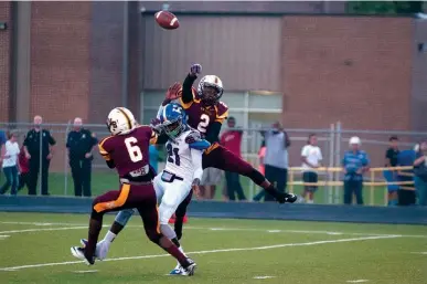  ?? Staff photo by Jerry Habraken ?? New Boston’s Jon House, top, knocks down a pass intended for Hooks’ Montrell Estell, with New Boston’s Deandre Robinson defending during the first quarter Friday at Lion Stadium in New Boston, Texas.