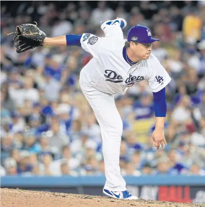  ??  ?? The Dodgers’ Ryu Hyun-Jin pitches against the Braves during Game One of the National League Division Series.