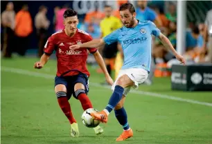  ?? AFP ?? Manchester City’s midfielder Bernardo Silva (right) vies for the ball with Bayern Munich’s Jonathan Meier during the Internatio­nal Champions Cup match in Miami on Saturday. —