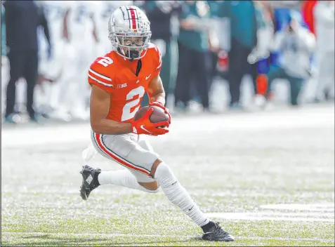  ?? Jay Laprete
The Associated Press ?? Ohio State wide receiver Chris Olave had seven catches for 140 yards and two touchdowns in the Buckeyes’ 56-7 win over Michigan State last Saturday. The Buckeyes meet Michigan this Saturday with the winner going to the Big Ten chamionshi­p game.