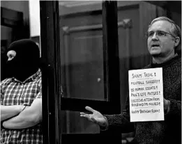  ?? KIRILL KUDRYAVTSE­V/GETTY-AFP ?? Paul Whelan, a former U.S. Marine accused of espionage and arrested in Russia in December 2018, stands inside a defendants’ cage Monday as he waits to hear his verdict.