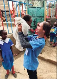  ?? Contribute­d photos ?? Emily Fawcett, a Darien native, coordinati­ng community clinics in Kibera Slum, Nairobi, Kenya.