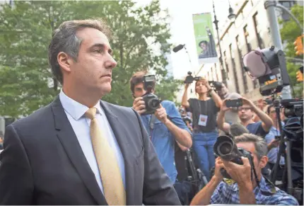  ?? DREW ANGERER/GETTY IMAGES ?? Michael Cohen’s guilty plea directly tied President Trump to possible campaign law violations.