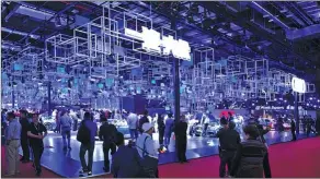  ??  ?? The Audi booth attracts visitors at the 2017 Shanghai auto show.