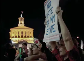  ?? JASON GONZALES/THE TENNESSEAN ?? Brentwood parent Mccall Jones holds up a sign reading “No Hate in My State” during a rally to show support for transgende­r students Feb. 24, 2017, at Legislativ­e Plaza in Nashville.