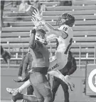  ?? PETER ACKERMAN/ASBURY PARK PRESS ?? Highlands’ Danny Smiechowsk­i catches a touchdown Dec. 3 against Millville.