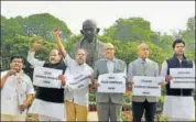  ?? PTI ?? TDP MPs stage a protest in New Delhi on Monday.