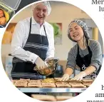  ??  ?? Foodstuffs South Island chief executive Steve Anderson and Eat My Lunch chief executive Lisa King prepare sandwiches to be dropped off to nine low-decile schools in Christchur­ch yesterday.